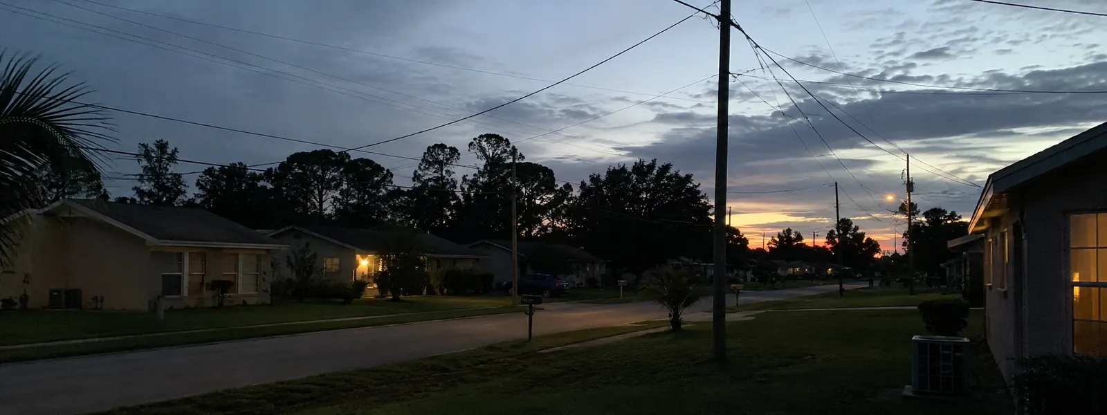 Quiet residential street at dusk in a Florida neighborhood
